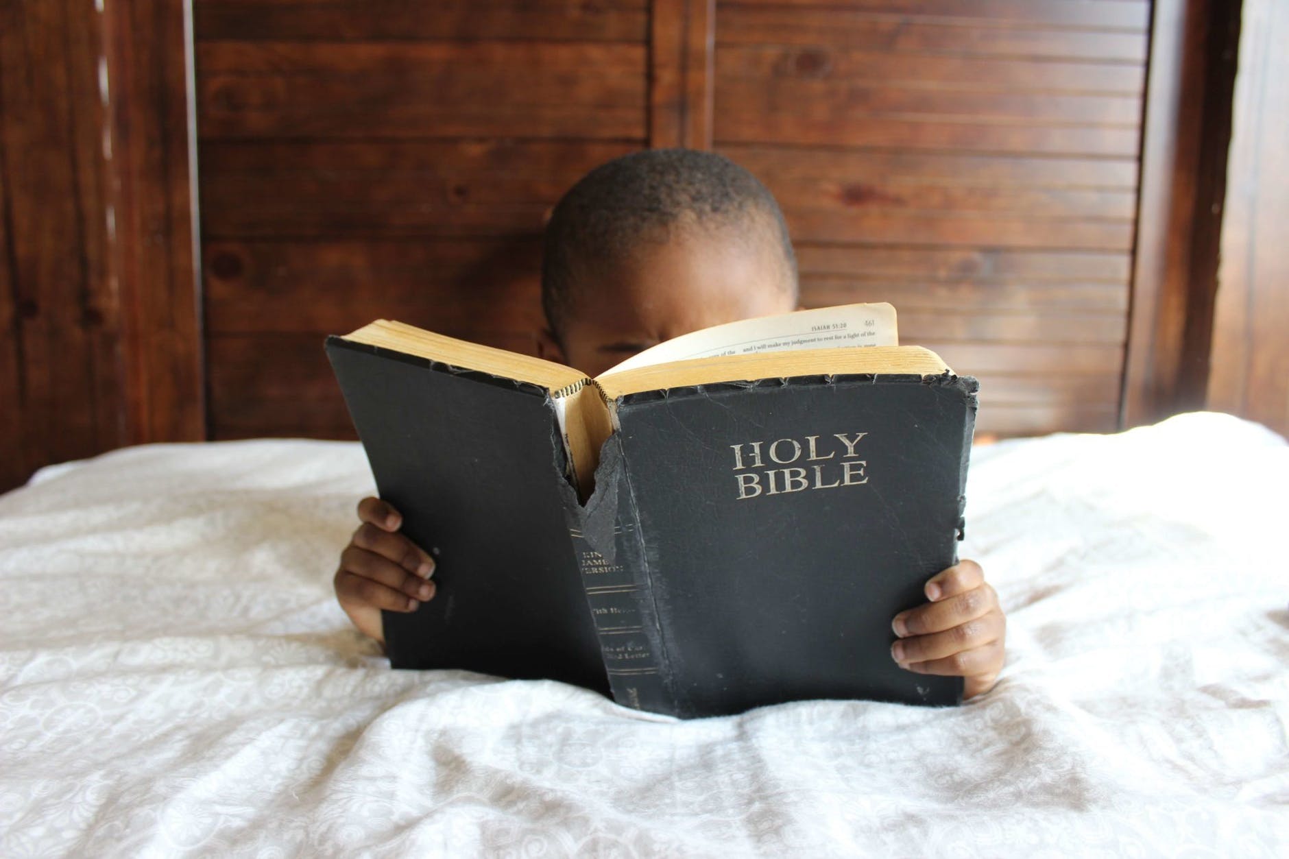 a child reading the Holy Bible