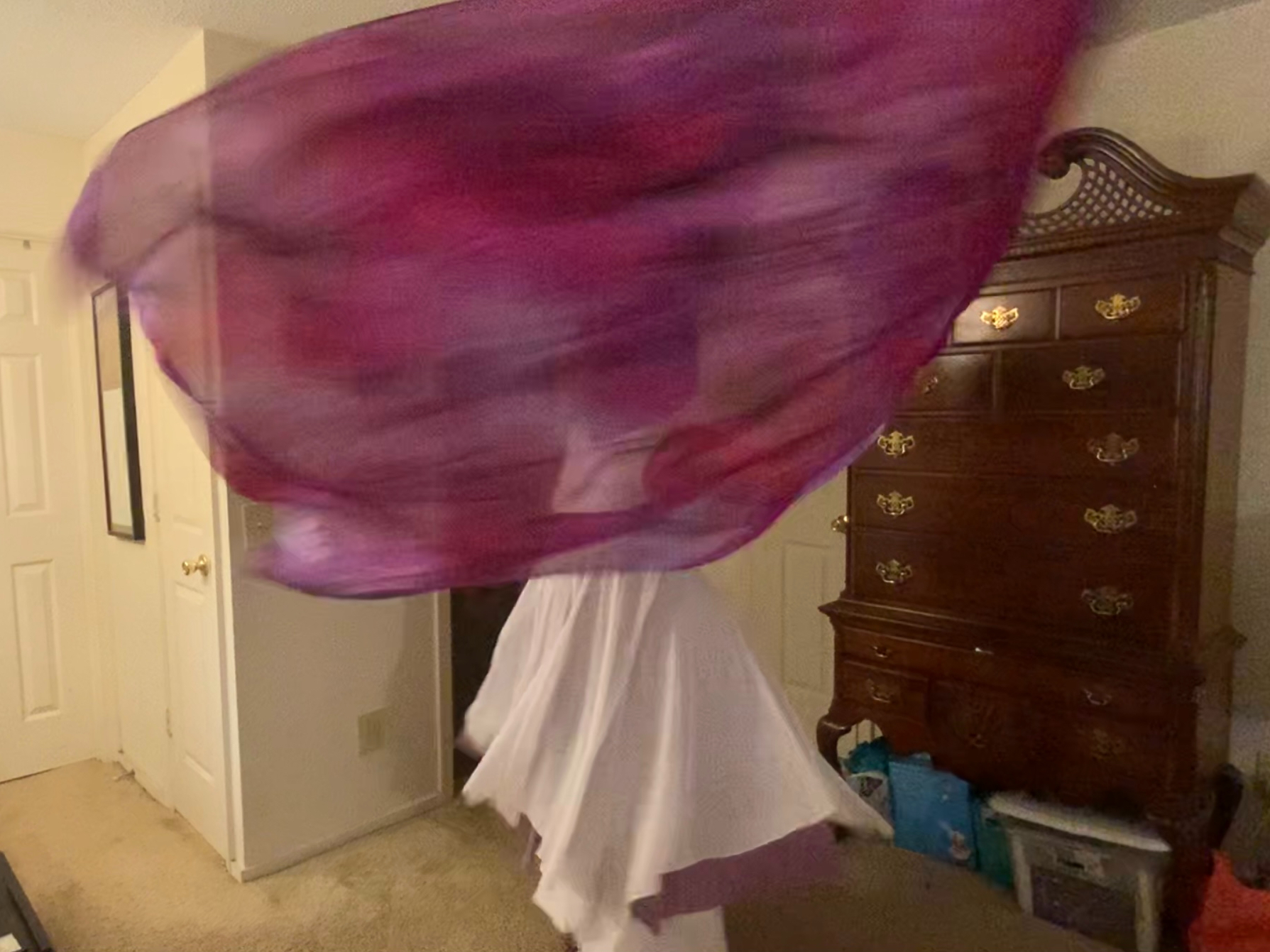 Michelle spinning with purple flags