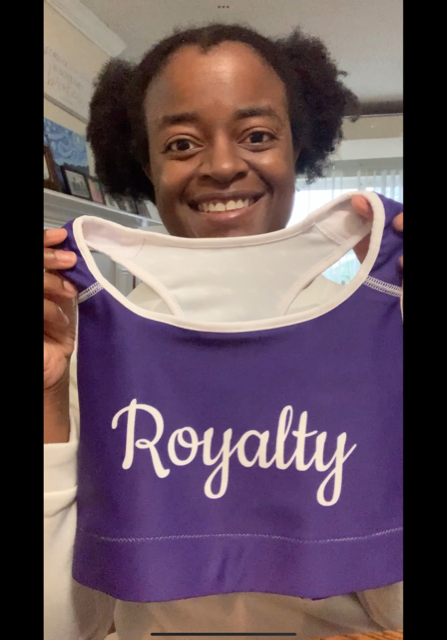 Michelle holding the purple Royalty Sports Bra