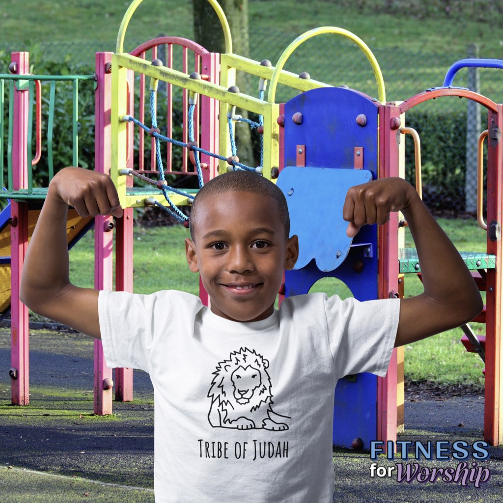 Boy in playground wearing white Lion Tribe of Judah Short Sleeve T-Shirt for Toddlers by Fitness for Worship