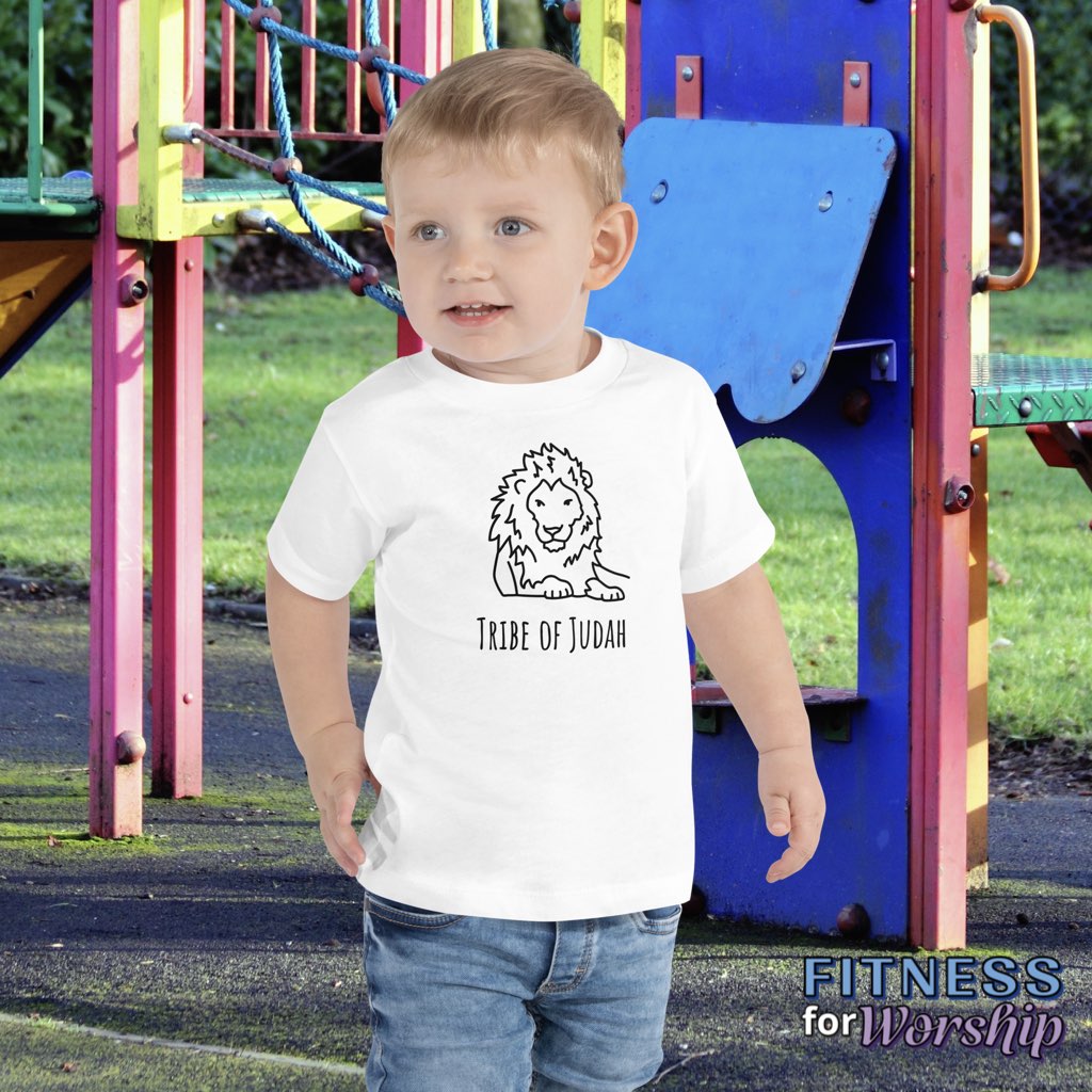 boy on a playground wearing white Lion Tribe of Judah Short Sleeve T-Shirt for Toddlers by Fitness for Worship