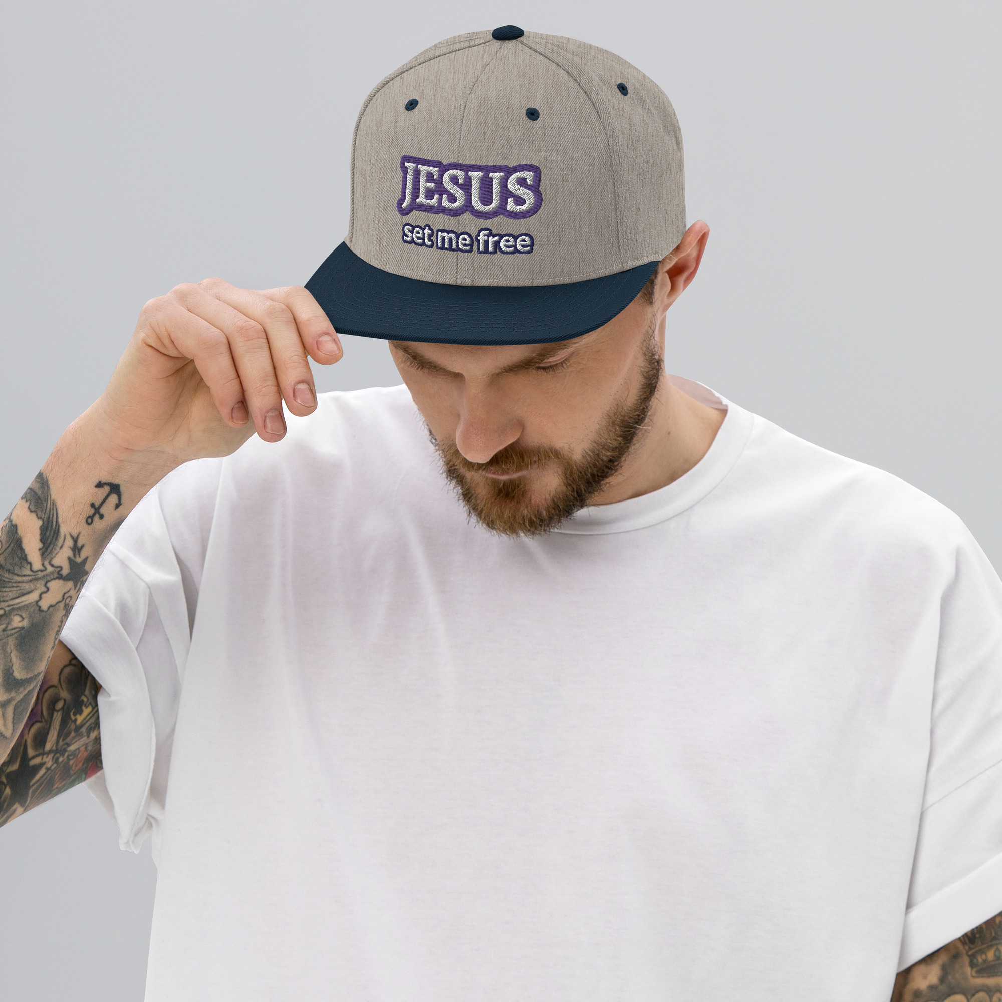 man wearing JESUS Set Me Free Two-Tone Snapback Hat by Fitness for Worship