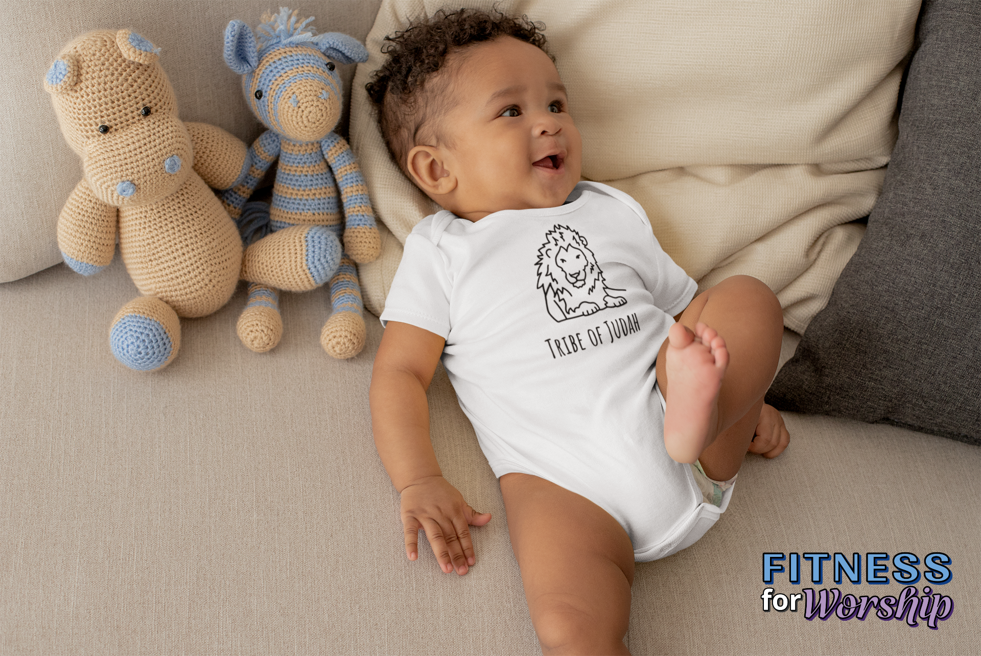 Baby boy wearing white Lion Tribe of Judah Baby One Piece Bodysuit by Fitness for Worship