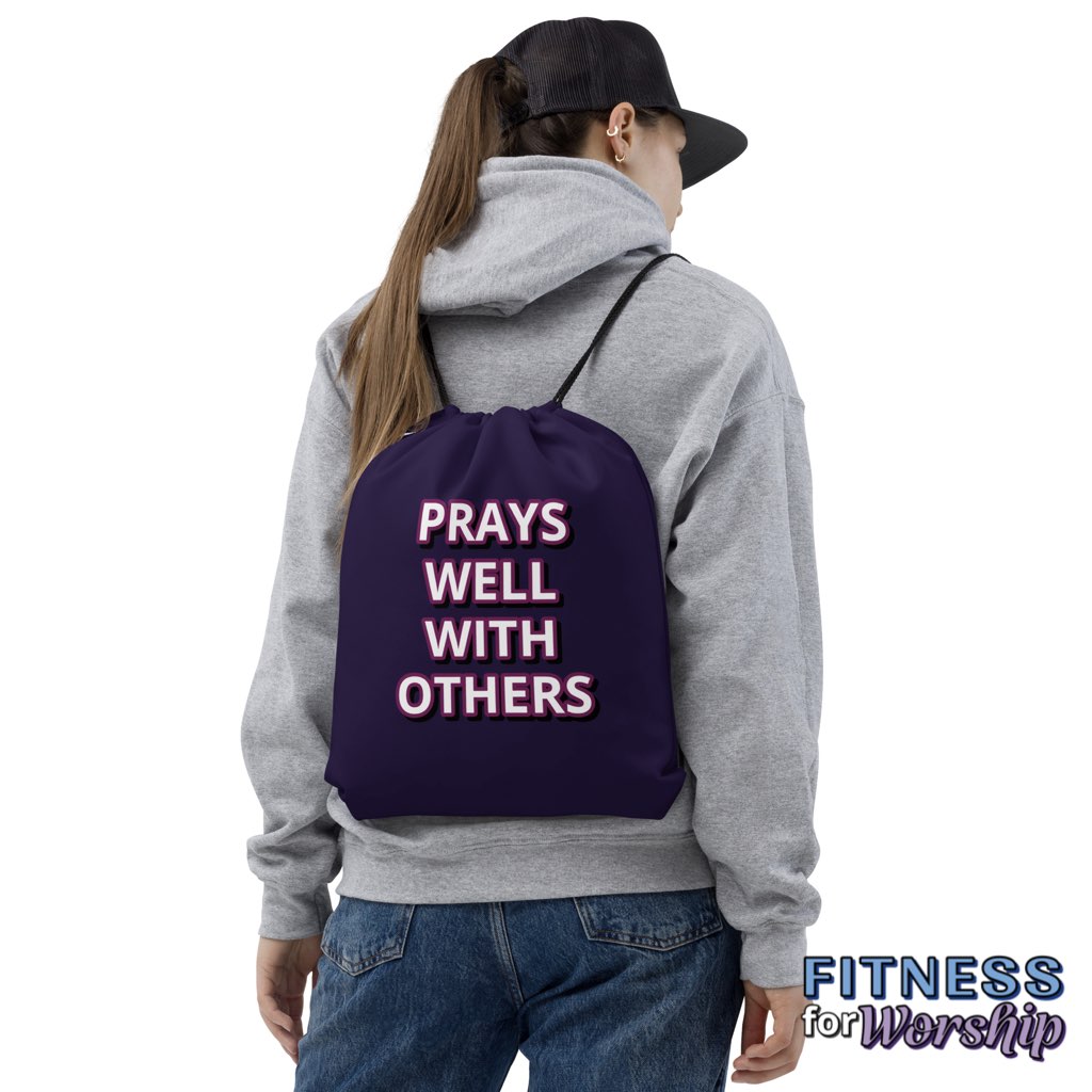 Woman wearing “Prays Well With Others” Purple Drawstring Gym Bag by Fitness for Worship