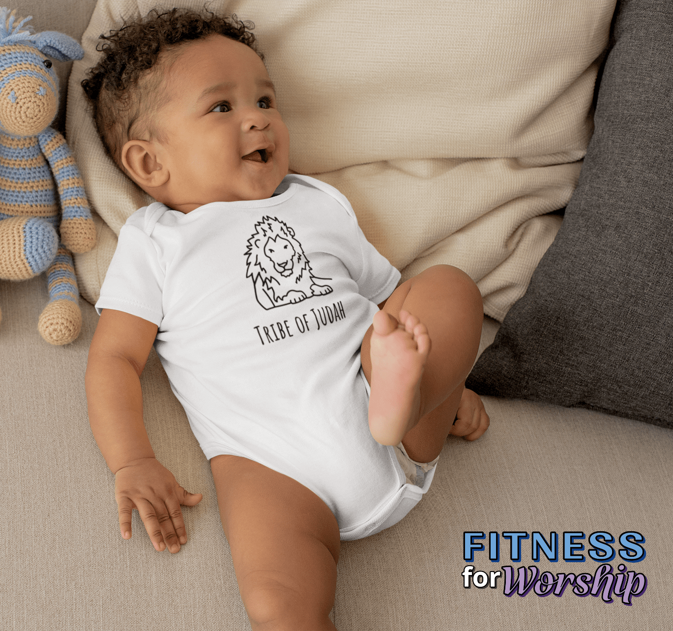 Baby boy wearing white Lion Tribe of Judah Baby One Piece Bodysuit by Fitness for Worship_cropped